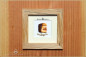Preview: Koroit Boulder Opal - 24,28ct - Silver Edition in 12x12cm beech stoked wooden frame
